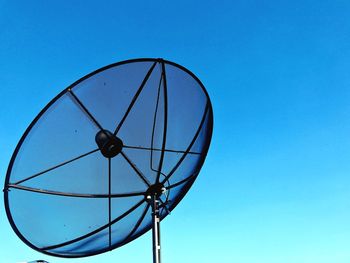 Low angle view of basketball hoop against blue sky