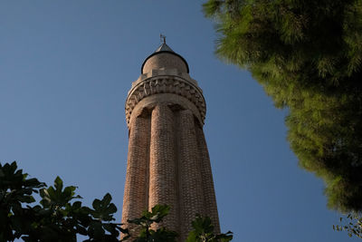 Low angle view of bell tower against sky