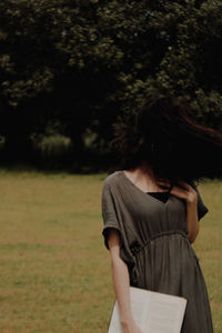 Young woman reading book