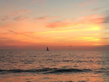 Scenic view of sea against dramatic sky