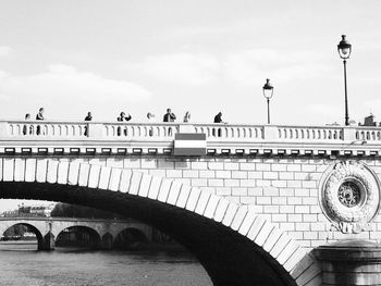 View of bridge against cloudy sky