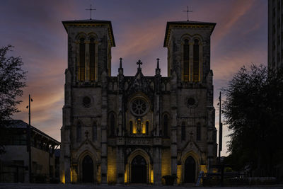 Low angle view of building against sky during sunset