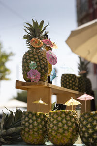 Close-up of pineapples on display at market stall