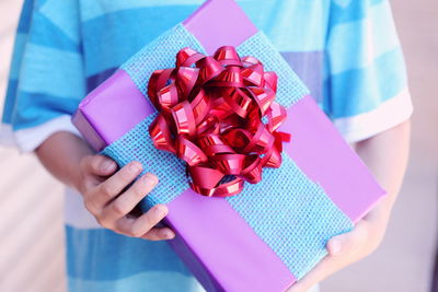 High angle view of boy holding present