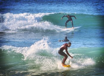 Low angle view of surfer surfing in sea