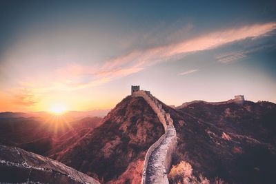 Great wall of china against sky during sunset