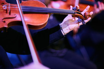 Cropped image of musician playing violin