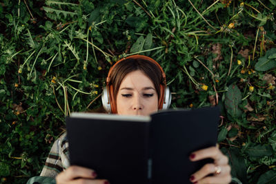 Portrait of young woman using mobile phone