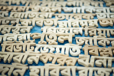 Close-up of wooden text on table