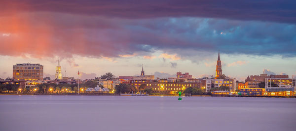 Illuminated city at waterfront