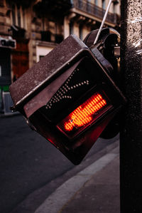 Close-up of broken stoplight in city