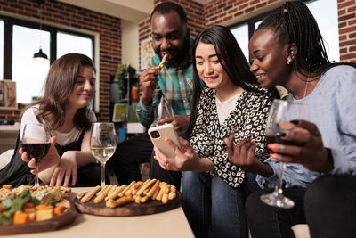 Friends having food at restaurant