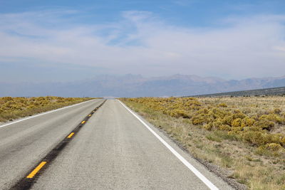 Empty road against sky