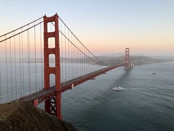 View of suspension bridge over sea