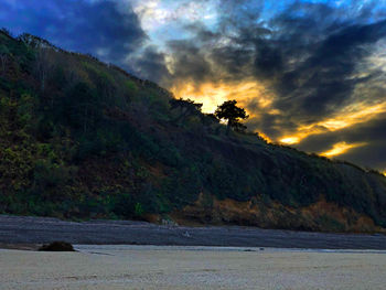 Scenic view of mountains against sky during sunset