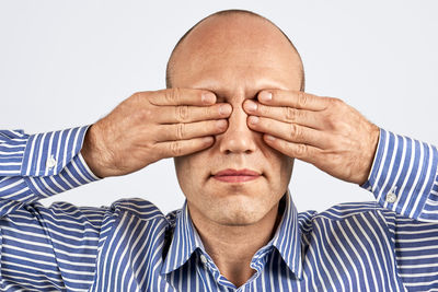 Close-up of a man over white background