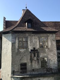 Low angle view of old building against clear sky