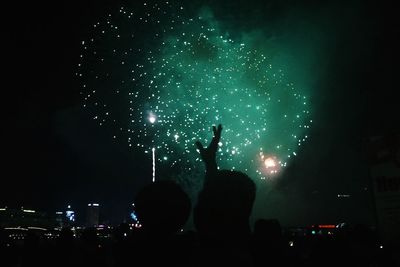 Firework display at night