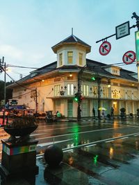 View of city street and buildings during rainy season