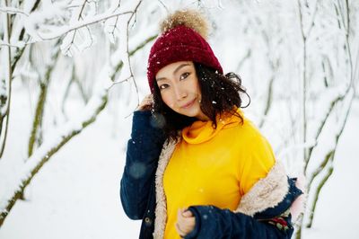 Portrait of young woman wearing hat during winter