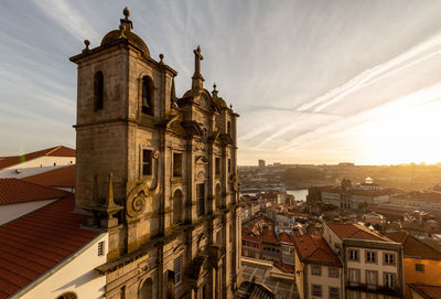 Panoramic view of buildings in town against sky