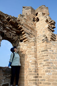 Woman standing on jinshangling at great wall of china