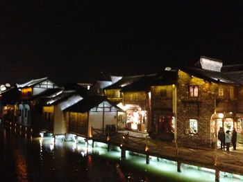 Reflection of illuminated buildings in water