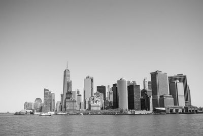 Sea with skyscrapers in background