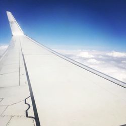 Low angle view of airplane flying in sky