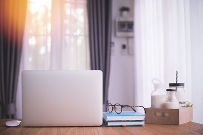 Close-up of laptop on table at home