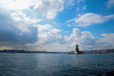 View of sea and buildings against sky