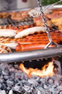 Close-up of sausages on barbecue grill