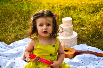 Adorable little girl on blanket summer picnic. cute baby are playing in the summer park. kid girl