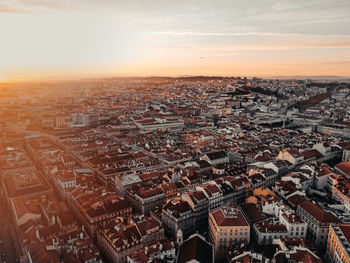 High angle shot of townscape against sky at sunset