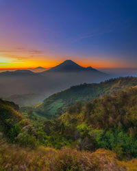 Scenic view of mountains against sky during sunset