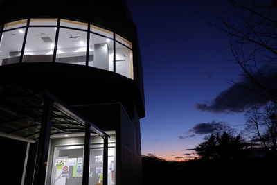 Low angle view of building against sky at night