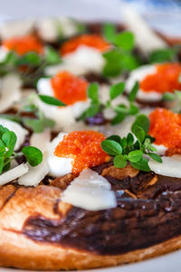 Close-up of pizza served in plate