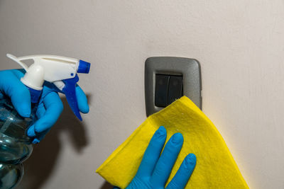 Close-up of yellow paint on white wall