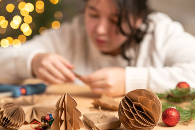 Midsection of young woman preparing food at home