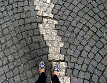 Low section of people walking on footpath