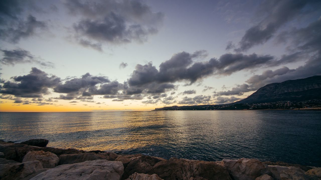 water, sea, sky, scenics, tranquil scene, beauty in nature, cloud - sky, tranquility, horizon over water, rock - object, sunset, nature, cloudy, cloud, shore, idyllic, beach, dusk, outdoors, rock formation