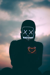 Close-up of silhouette man against sky during sunset