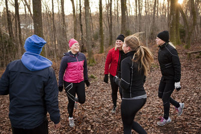 Women training in forest  on the move