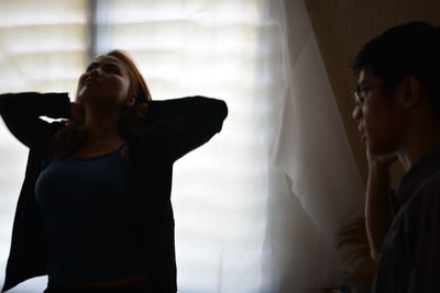 Woman standing in a corridor