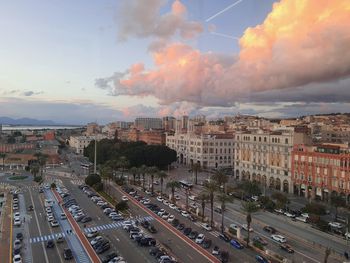 High angle view of city street and buildings against sky