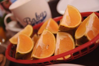 Close-up of orange fruits in container