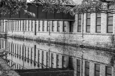 Reflection of building in puddle