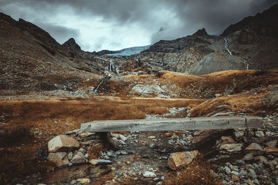 Path that leads to the fellaria glacier, points on a stream. on the italian alps.