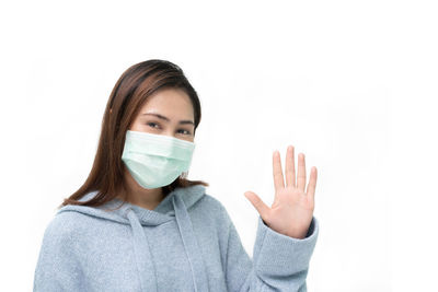 Portrait of a beautiful young woman over white background