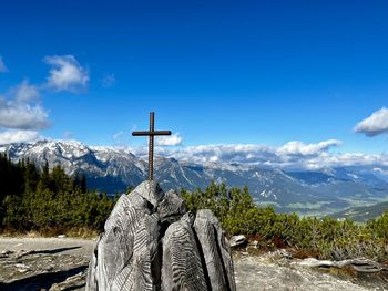 Scenic view of mountains against blue sky